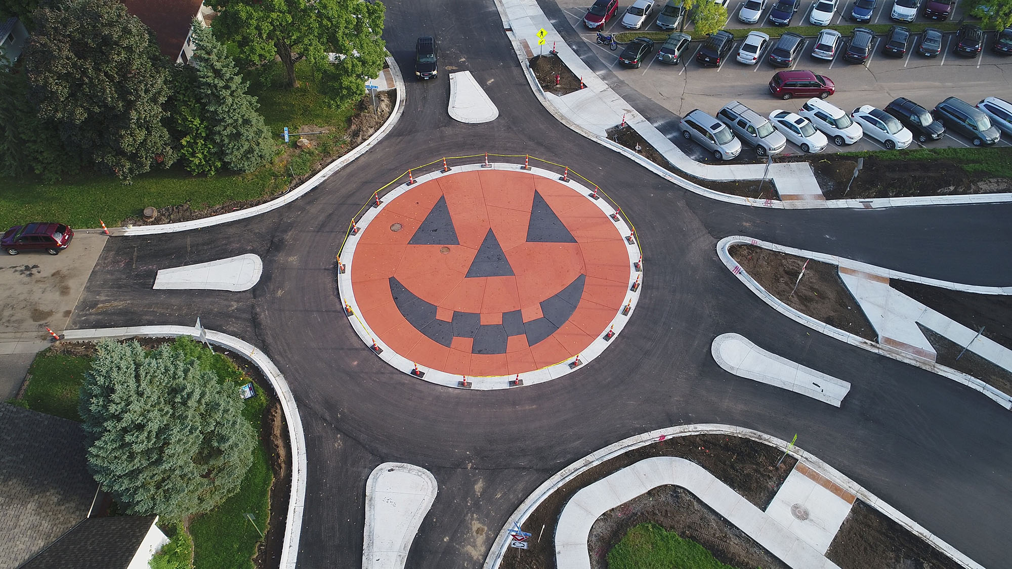 an image of a round about painted like a pumpkin